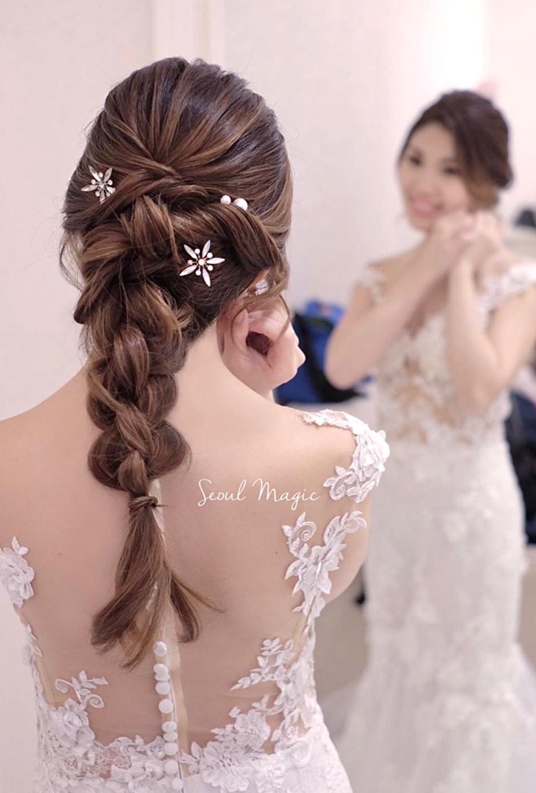 Braided updo with pearl and flower hair pins, styled by Seoul Magic